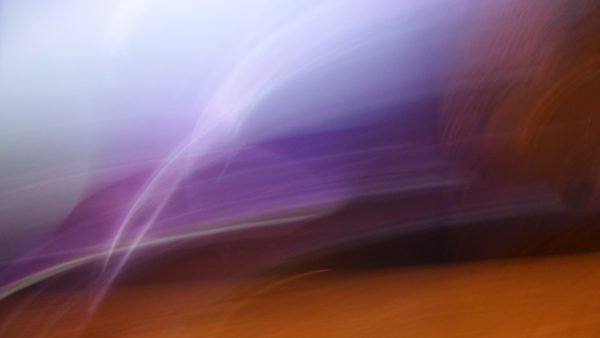 Orange dominates the purple and blue hues artistic blur photograph