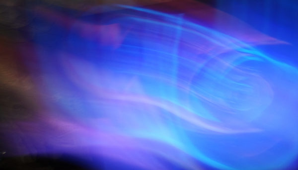 Blue, purple, and green colors blend into modern artistic blur photography