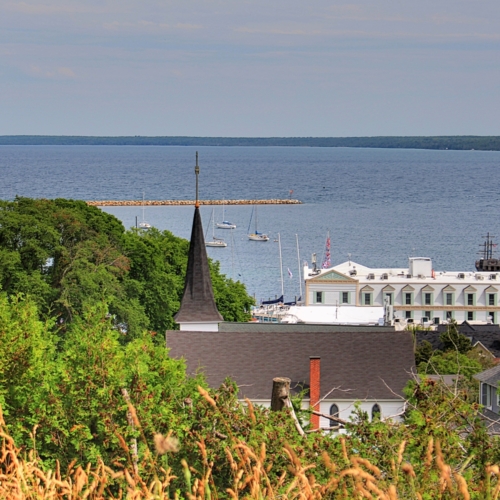 scenic view overlooking mackinac island sail boats in distance