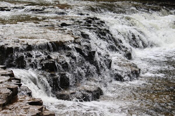 water running of a small rocky waterfall