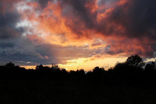 brilliant clouds changing colors at sunset