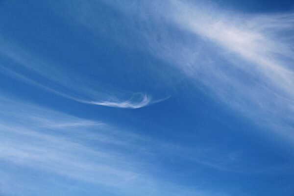 cloud shaped like a hand with pointing finger in the sky