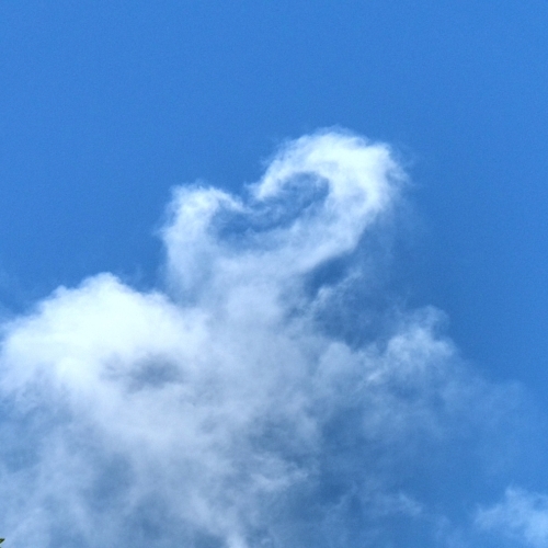 cloud with a heart shape extending from the top