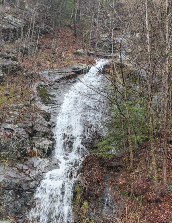 waterfall running down the side of a mountain