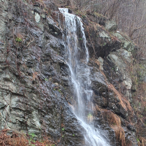 waterfall running down the side of a mountain