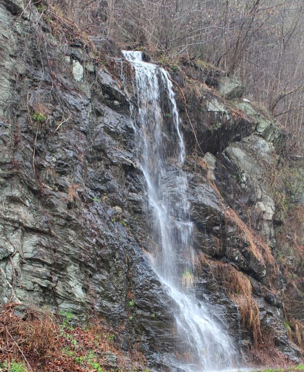 waterfall running down the side of a mountain