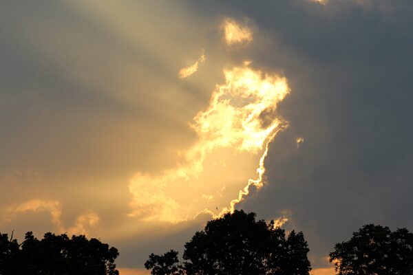 yellow sunbeam open up through the clouds